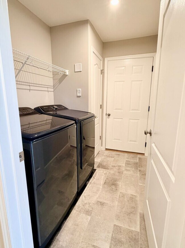 Building Photo - Exquisite just built condo with everything! Ground floor, no stairs, attached garage