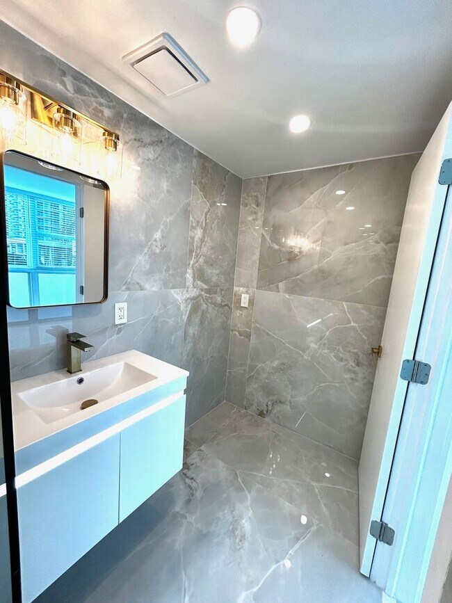 Building Photo - Fully Renovated East-Facing 2BR/2BA + Bonus Room | Ocean Views | In-Unit W/D