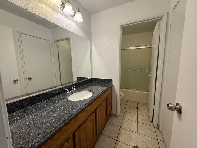 Building Photo - Two Bedroom Triplex with One Bathroom and ...