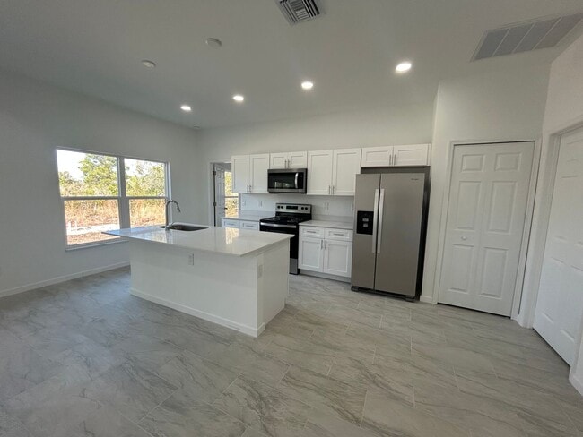 Building Photo - JUST BUILT! Spacious 4/2/2 Home -Perfect for Your Family in SW Lehigh Acres