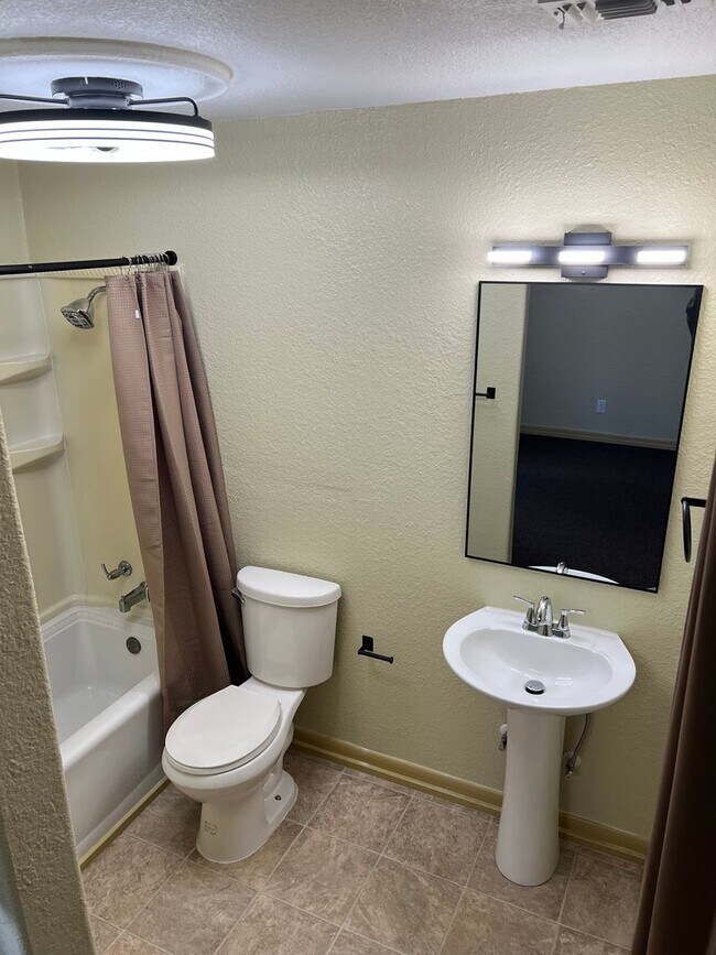 Building Photo - Remodeled Suburban Apartment