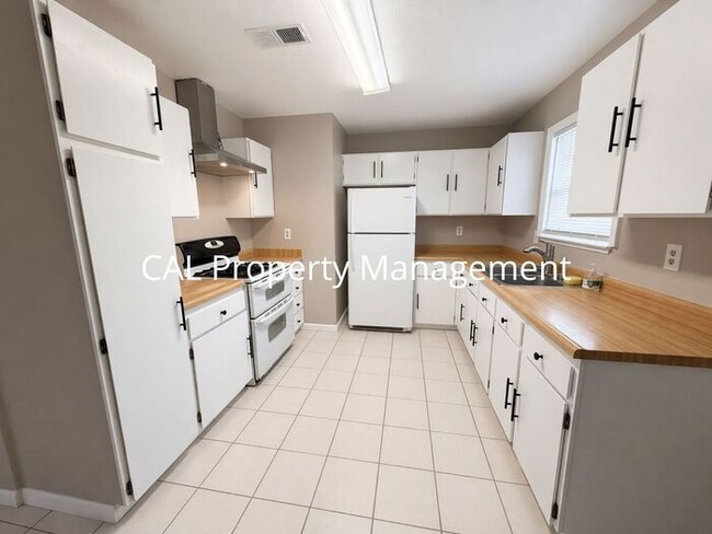 Building Photo - Spacious 4-Bedroom Home with 2-Car Garage & Backyard Oasis