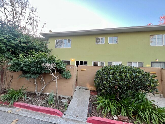 Back patio access to garage area - 5367 Village Grn