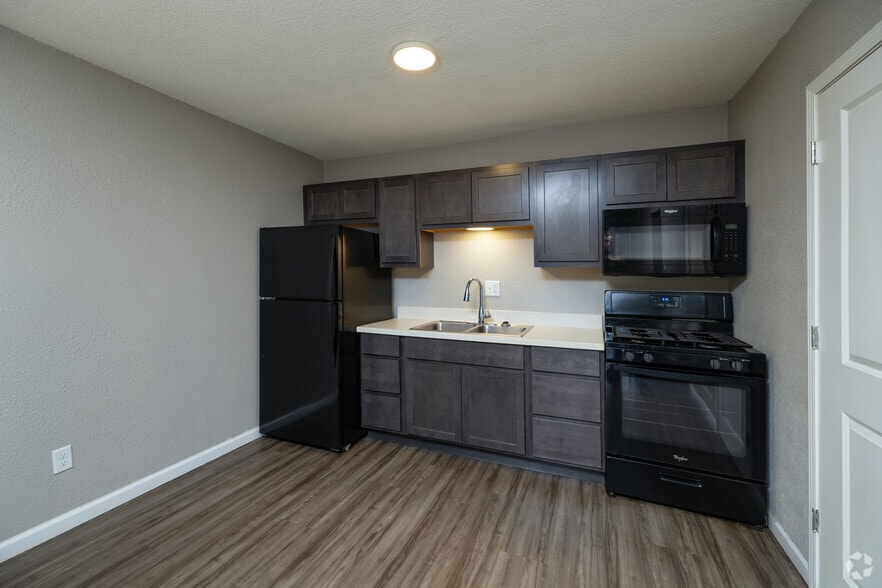 Fully Equipped Kitchen and Ample Cabinetry - Arbor Village Apartments