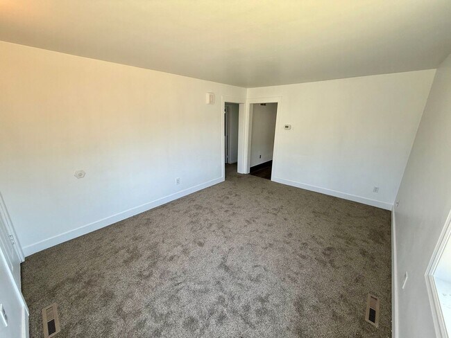 Building Photo - For Rent: 2 Bedroom, 1 Bathroom Home with Garage and Large Yard