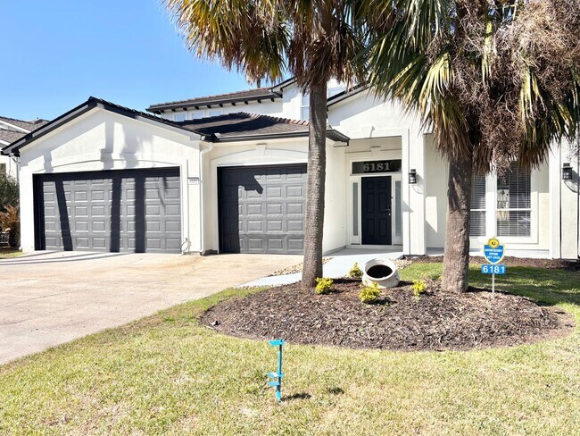 Building Photo - Stunning 5-Bedroom Home with Breathtaking Lake & Golf Course Views – Pelican Point Subdivision