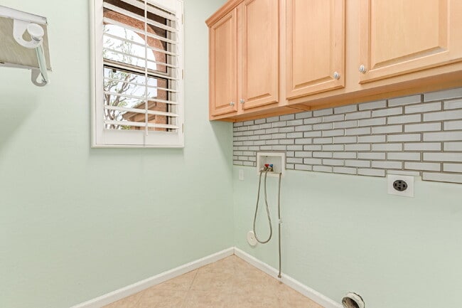 Building Photo - "Charming 2-Bedroom + Den Oasis with Spaci...
