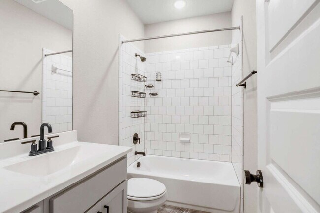 Building Photo - "Spacious 4-Bedroom Sanctuary with Cozy Fireplace in San Antonio's Prime Location!"