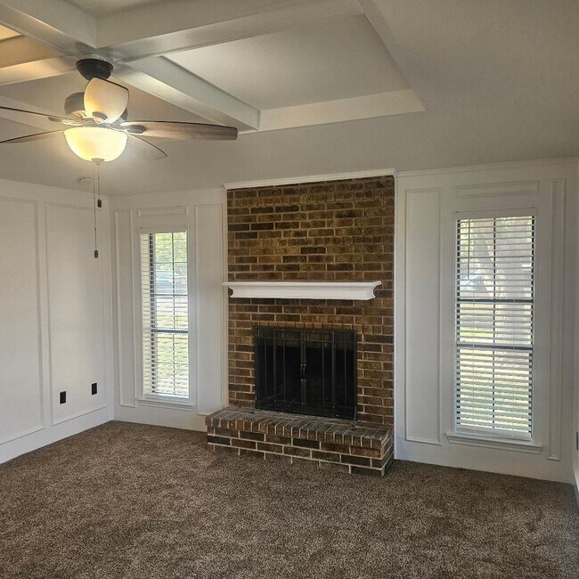 Building Photo - Three bedroom and two bathroom nicely remodeled with new flooring. Large wood fenced backyard