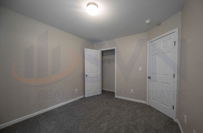 Building Photo - Welcome to this spacious 4-bedroom, 2.5-ba...