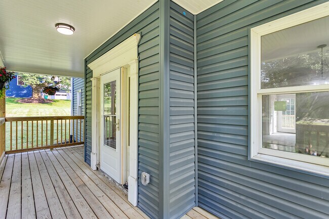 The deck and roof are newly built, brand new vinyl siding, brand new front door - 2416 Magee Road Ext