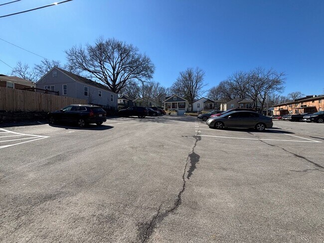 Building Photo - Top-Floor Plaza Condo with Vaulted Ceilings & Dual Balconies