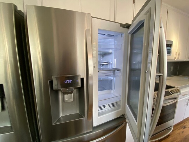 Building Photo - TWO PARKING SPACES INCLUDED! In Unit Washer & Dryer! Large Private Patio for Bikes, Boards and Bb...