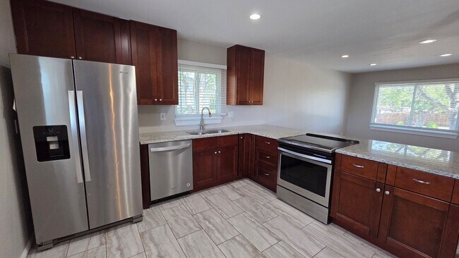 Building Photo - 4 Bedroom 2 Bath with Finished Basement and Study!