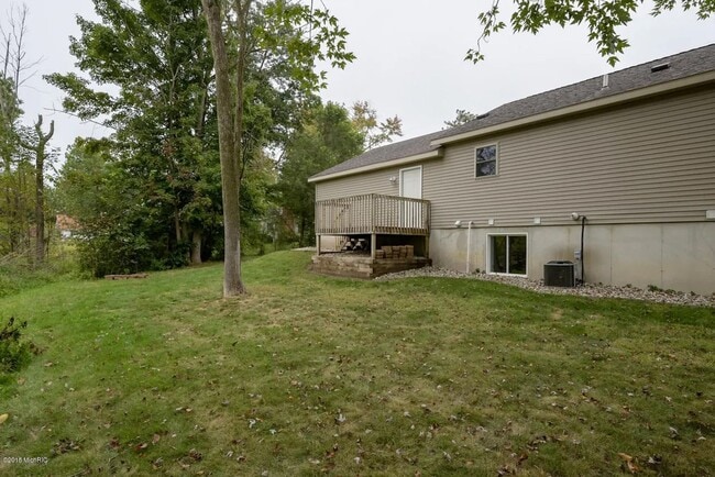Building Photo - Spacious 3BR Duplex with Finished Basement & 2-Car Garage in Otsego