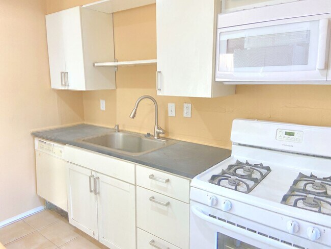 Building Photo - Move-In Ready & Modern: Fully Remodeled 4BD with Massive Yard