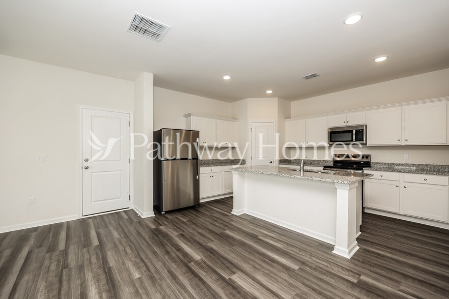 Building Photo - 202 Wild Daisy Wy