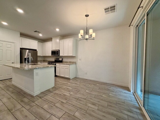 Building Photo - GATED 3 BED 2.5 BATH TOWNHOME WITH 2-CAR GARAGE, COVERED PATIO & COMMUNITY POOL
