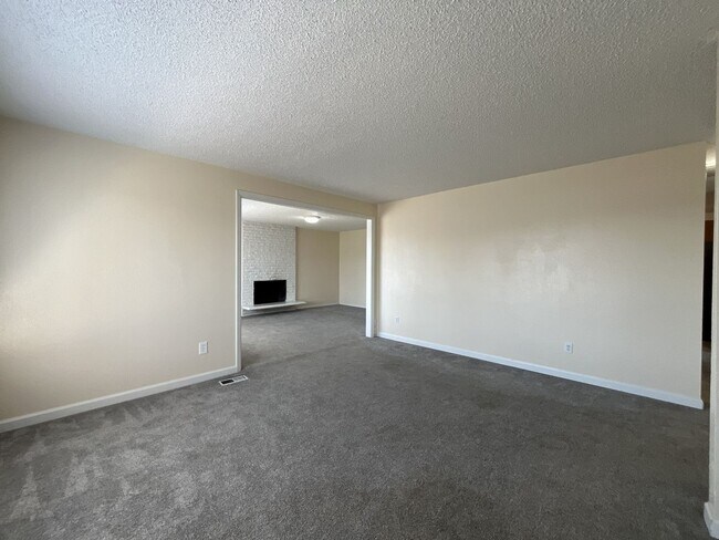 Building Photo - Charming Ranch Home with Sunroom or 4th Bedroom, Two-Car Garage and Fenced Backyard