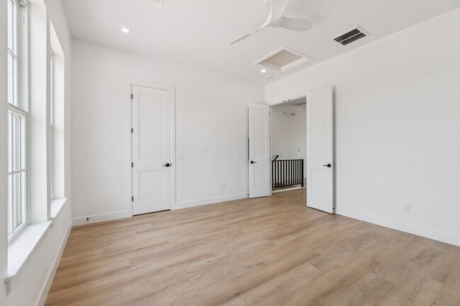 Building Photo - Bright. Clean. Calm. Your Elevated One-Bed...