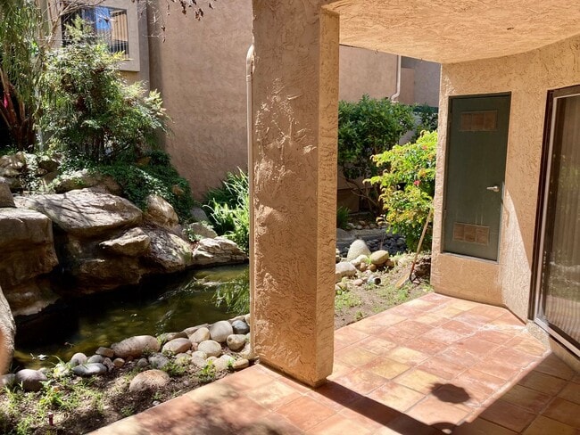 Building Photo - One Bedroom with Garage and IN-Unit laundry in Resort-Style Complex