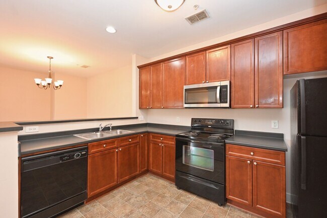 Building Photo - **PRISTINE GARDEN-LEVEL CONDO ON THE FIRST LEVEL NEAR PAVILION AND COMMUNITY GREEN SPACE**