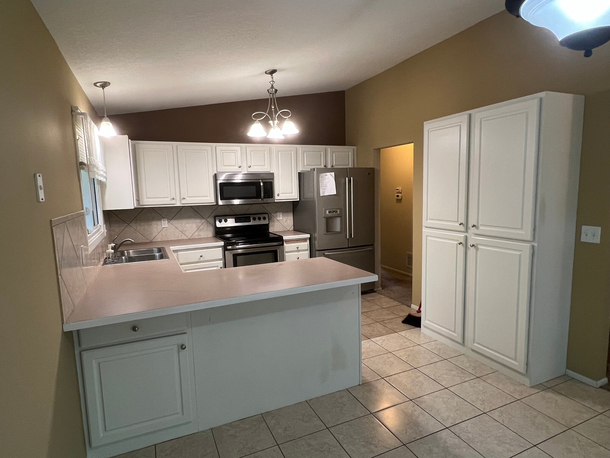 Kitchen with fridge, range, microwave and dishwasher - 6811 Balsam Ln N
