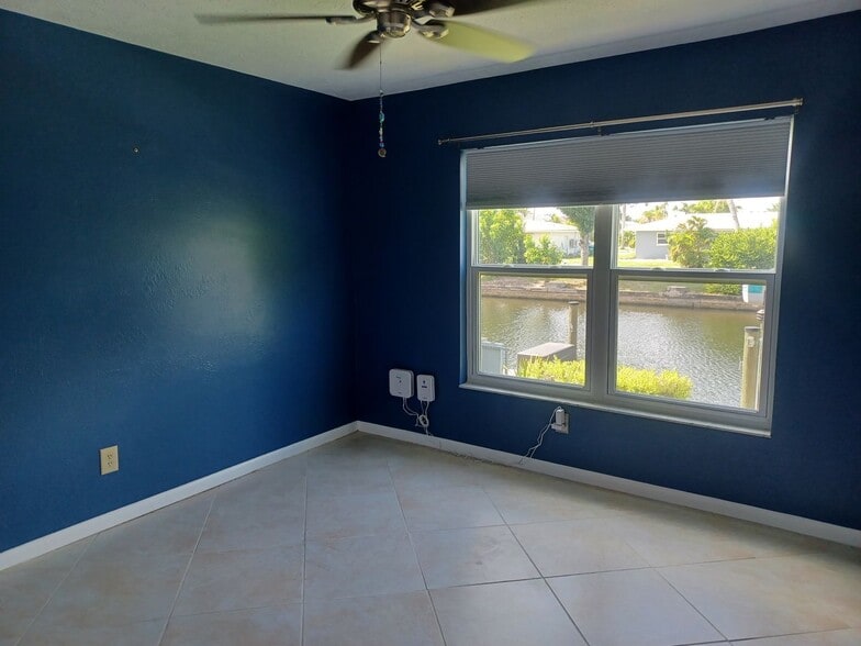 Building Photo - UPGRADED WATERFRONT END UNIT 3 BR / 2 BA Home With BOAT LIFT/ DOCK & OUTSTANDING VIEWS