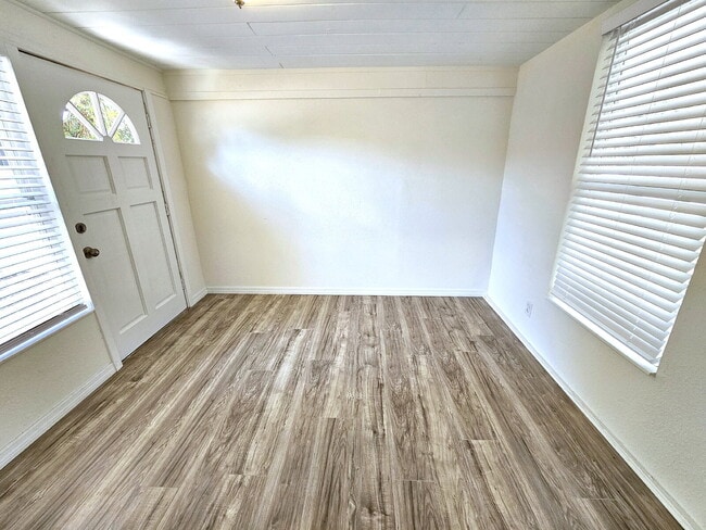 Building Photo - fully renovated 2-bedroom, 1-bathroom home with bonus guest room or office and oversized fenced yard