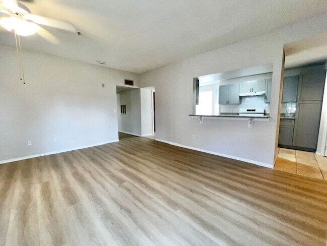 Building Photo - NEW-Remodeled bathroom & kitchen! NEW VINYL PLANK flooring & fresh paint! 2 bedroom 1 bath condo ...