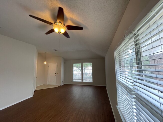 Building Photo - SPACIOUS HOME - NEW FLOORING! - 2 LIVING A...