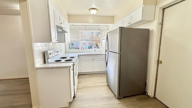 Building Photo - Recently Renovated House With Fenced Back Yard, Attached Garage, and Basement