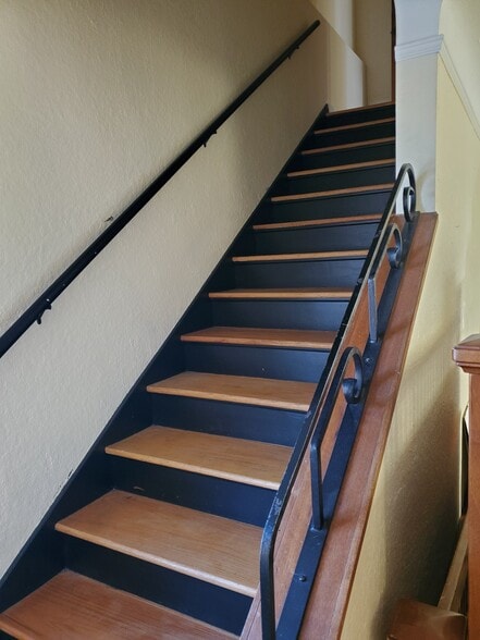 stairs to bedrooms and main bathroom - 3333 N Harrison St