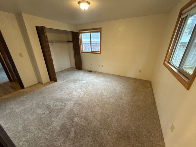 Building Photo - RV Parking, SMALL DOG OK, NE 3 Bdrm, 2 Bath House, All Appliances, Wood Stove, Dbl. Garage