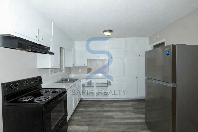 Building Photo - Timeless All-Electric Ranch Charm in a Vibrant, Peaceful Corner of South River Gardens