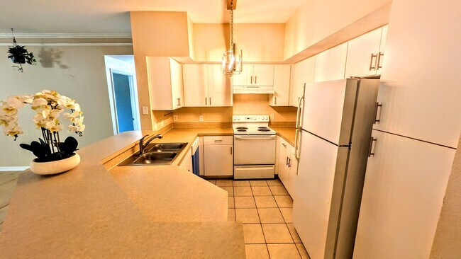 Building Photo - ANNUAL UNFURNISHED GROUND FLOOR CONDO 3 BED 2 BATH