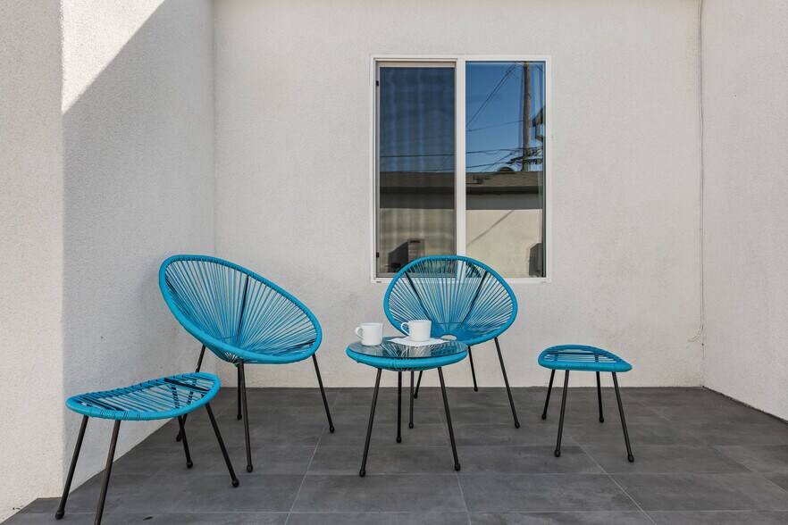 Private outdoor space behind the house for enjoying coffee and the natural sunlight. - 1823 N Ditman Ave