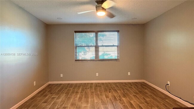 Building Photo - 6090 N Sabal Palm Blvd
