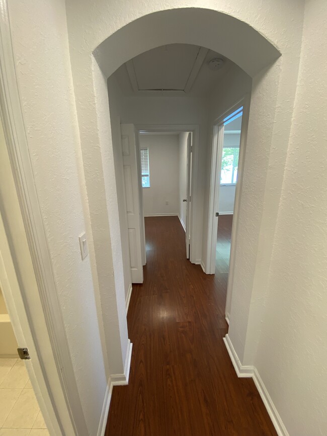 End of hallway with entrance to master bedroom on right and 2nd bedroom straight ahead - 2451 SE 14th Ave