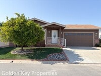 Building Photo - Welcome to the spacious single-level manuf...