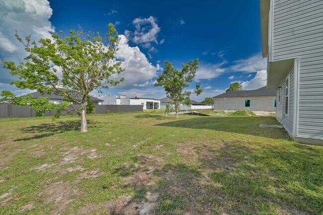Building Photo - 3BR/2.5BA Cape Coral Home w/ 2-Car Garage & Spacious Yard – Available Now!
