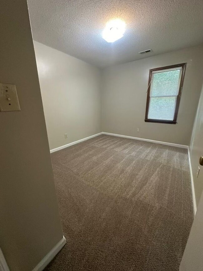 Building Photo - FRESH PAINT! NEW FLOORING! 3BR 2.5 BA Two-...