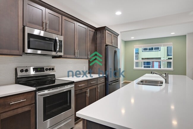 Building Photo - A Beautiful Corner Home Designed for Comfort, Light & Community!