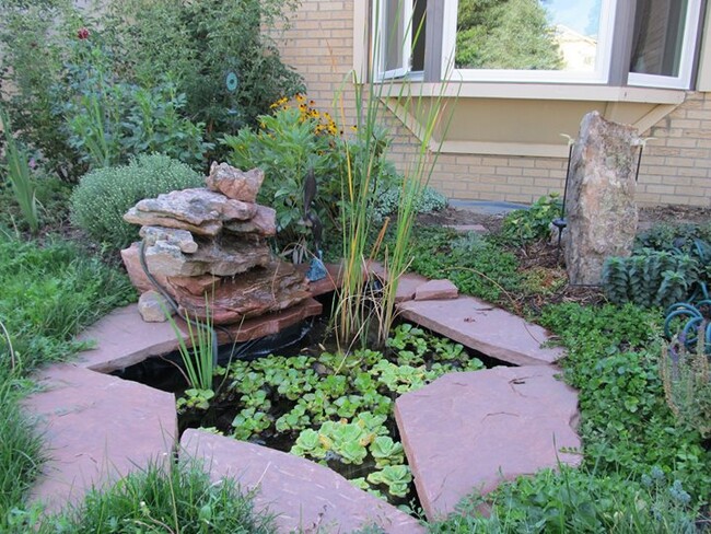 Bay window overlooking water feature and flower gardens. - 28 James Circle