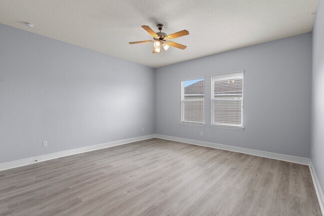 Building Photo - Spacious 6-Bedroom Home Near Lake Nona | 3-Car Garage + Tesla Charger