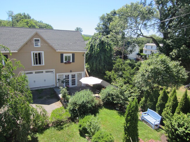 VIEW FROM SUN PORCH TO CARRIAGE HOUSE & BACKYARD - 35 Park Pl