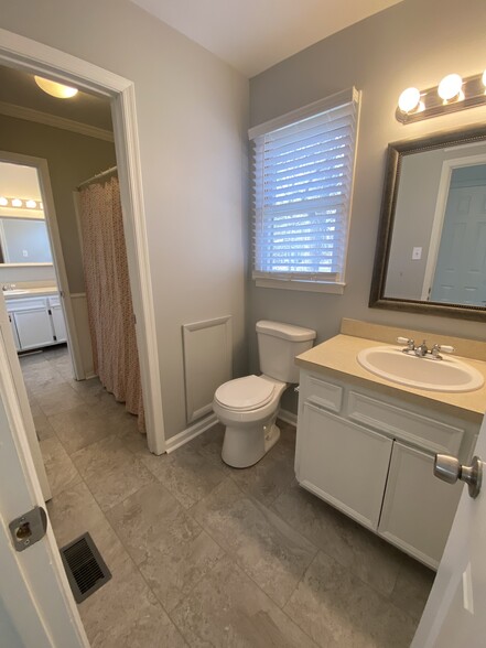 1/2 bath lookin through to Primary bathroom - 722 Branniff Drive