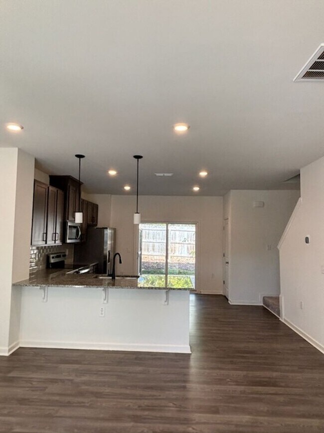 Building Photo - PRICE DROP ALERT! Available Now! New Construction Townhome