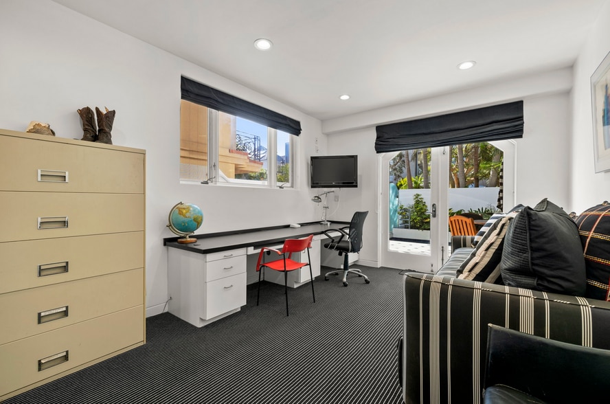 Second office or guest bedroom with large sleeper sofa, and ground floor deck access. - 120 Mast Mall