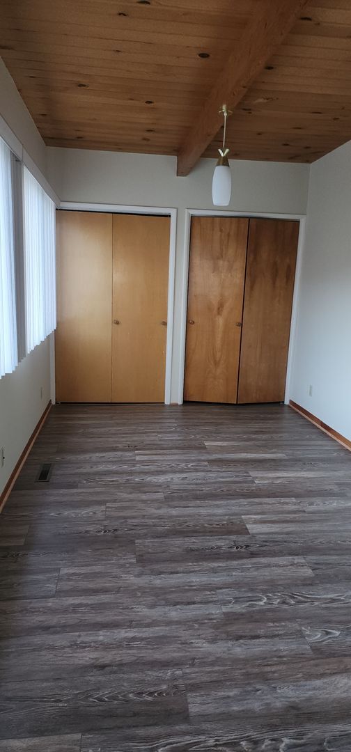 Building Photo - This is a spacious house featuring four bedrooms and two bathrooms, along with a two-car garage.